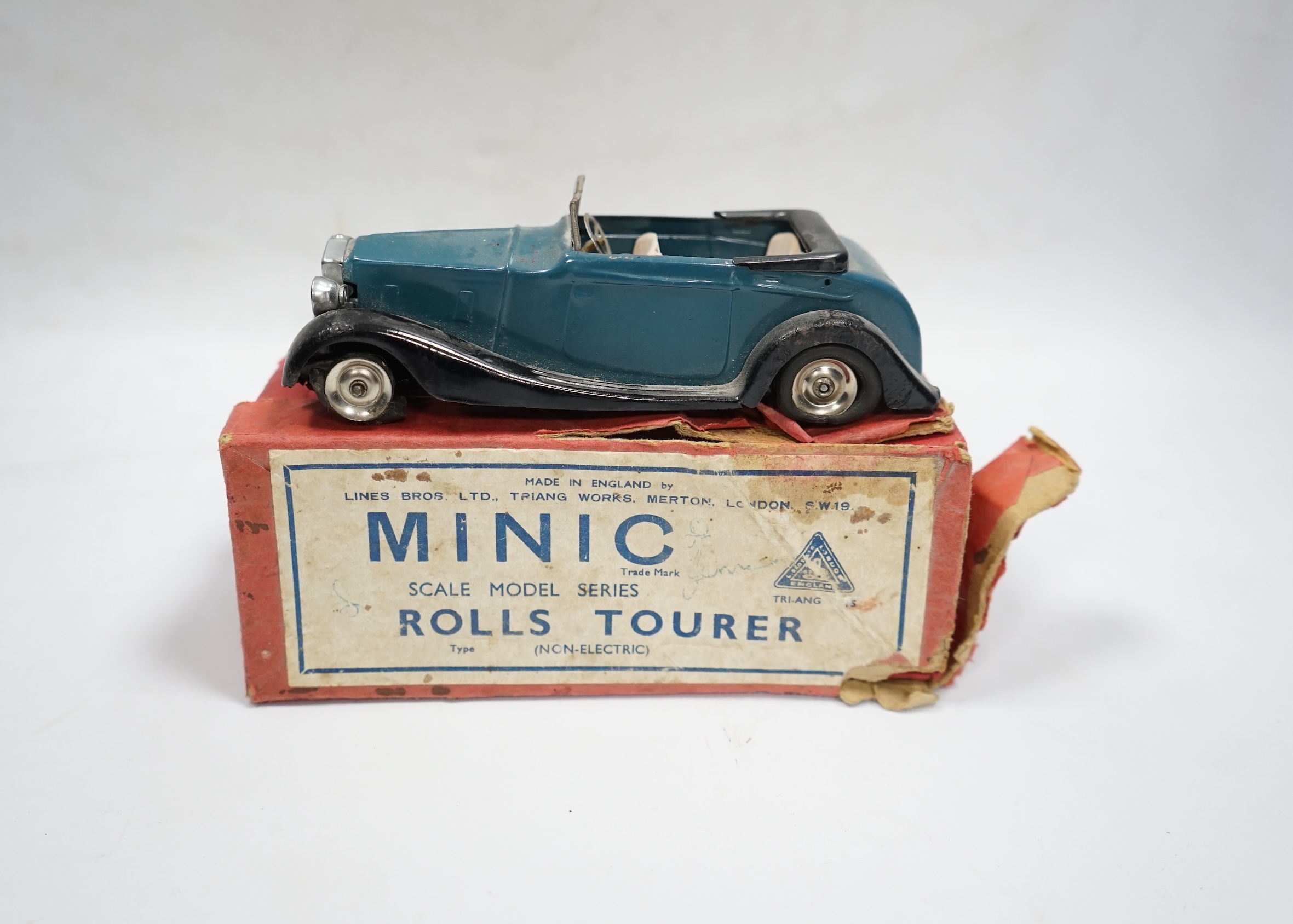 A Tri-ang Minic clockwork tinplate Rolls Royce Tourer, with aqua blue body, and black running boards, with its original box. Condition - fair, fatigue and missing parts to original tyres as would be expected, significant